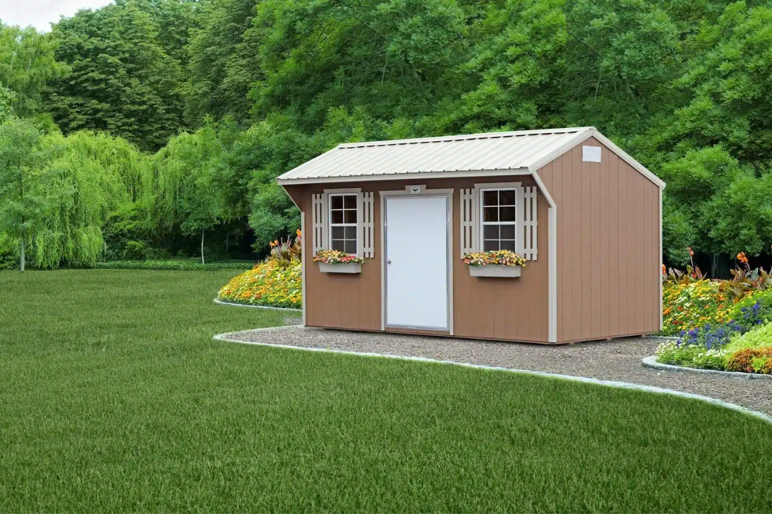 Bald Eagle Barn Shed set on gravel and blocks in garden outside Arkansas home. Shed has white doors, beige shutters and two windows with flower boxes