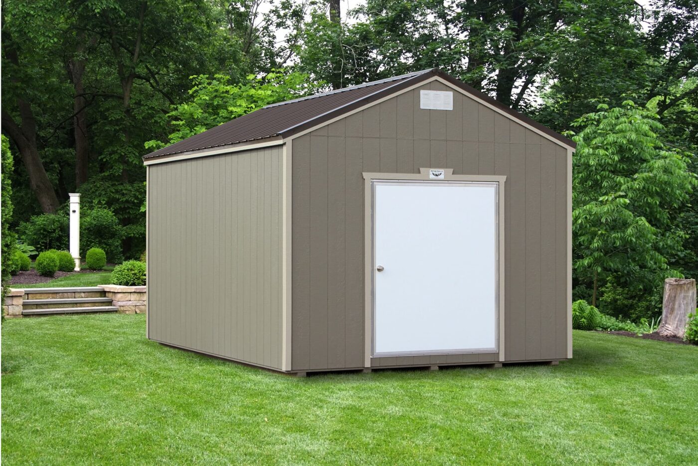 a grey portable workshop shed with beige trim, a dark grey metal roof, and a white door for sale in judsonia AR